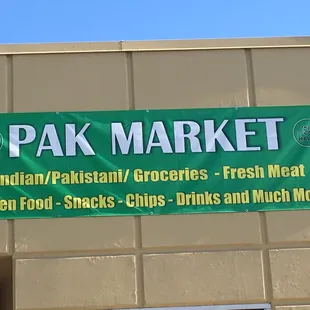 a green banner on the side of a building