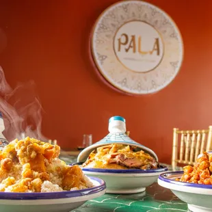 three bowls of food on a table