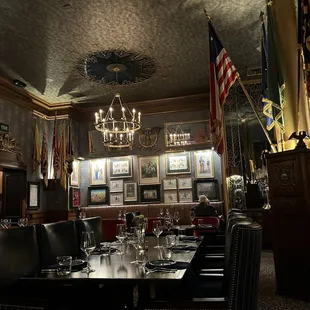 a formal dining room with a chandelier