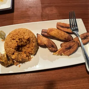 Sides from my platter - jollof rice and plantain. The goat for the platter was in a separate bowl
