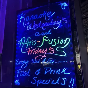 a neon sign in a window