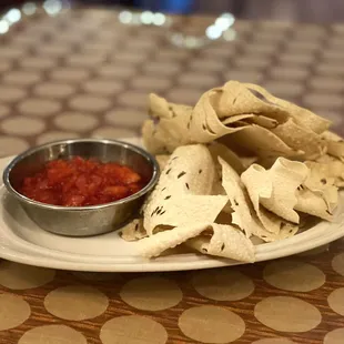 a plate of chips and salsa