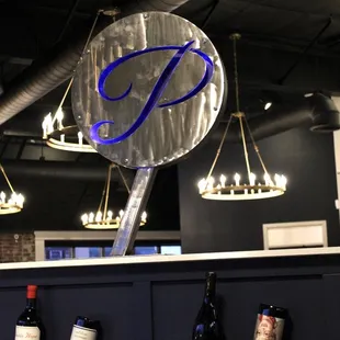 wine bottles and chandelier