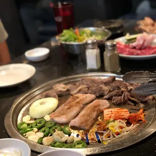 Beef brisket &amp; Pork Belly doing its thing along with some kimchi, beansprouts, jalepeno, garlic, and onion.