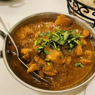 a bowl of curry and a bowl of rice