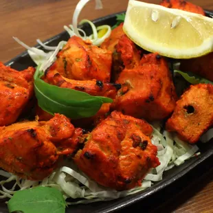 Chicken Tikka Sizzler,, Our sizzlers are just out of the world. Lean meats marinated overnight and cooked to perfection.