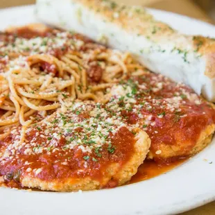 a plate of spaghetti and bread