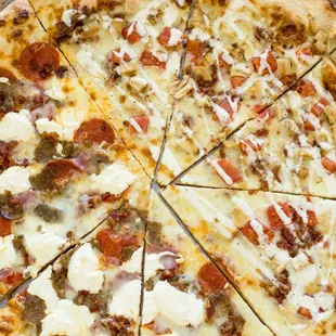 a pizza with cheese and sausage