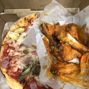Pizza and wings were so filling I had to take half to go.