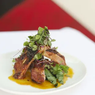 BABY BACK RIBS
calabrian chile sauce | preserved lemon | mint | parsley