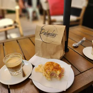 a sandwich and a cup of coffee