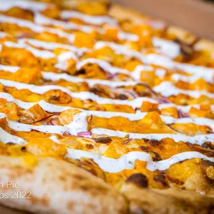 Red Dragon Pie Roasted chicken, Frank's Red Hot, sharp cheddar, shredded mozzarella, red onion, and house-made ranch.