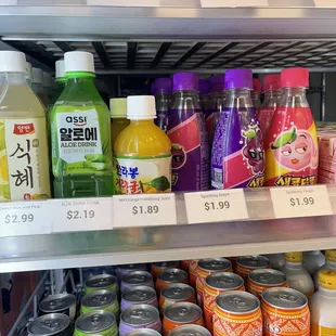 a variety of drinks in a refrigerator