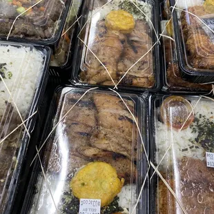 trays of meat and rice