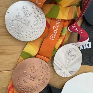 Para-Olympian Swimmer Elizabeth &quot;Lizzy&quot; Smith&apos;s silver and bronze medals, at Palama Settlement. Medals are solid and heavy stuff!