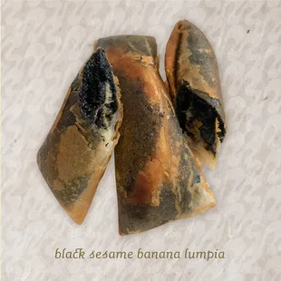 Black sesame banana lumpia - roasted black sesame butter with banana in a fried roll. (Sweet not savory)