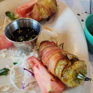 Trio Caribe Bacon wrapped peppers stuffed with shrimp and cheese.