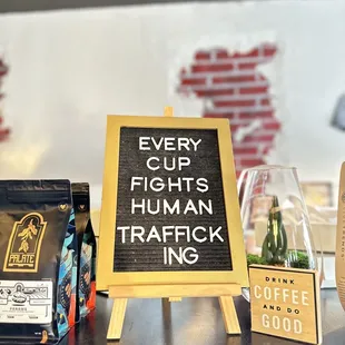 a sign that says every cup fights human trafficking