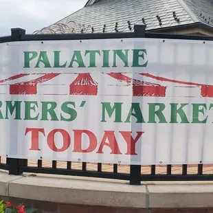 a sign in front of a gate