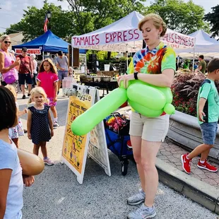 a woman holding an inflatable balloon
