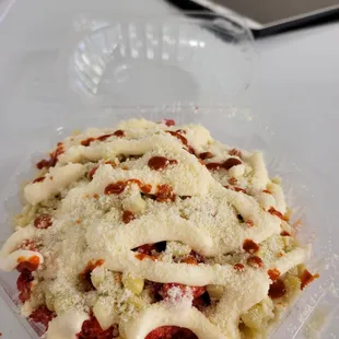 a plate of pasta and a cell phone