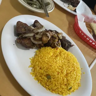 Pork chunks, yellow rice, Moro and green beans.
