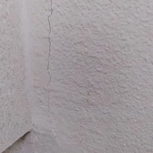 Cracking and bubbling in wall. Water damage
