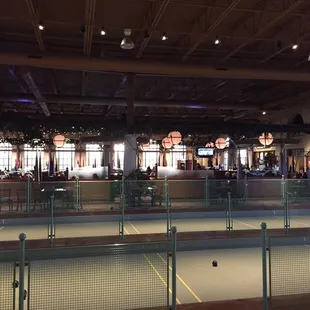 Bocce in foreground with dining room in back.