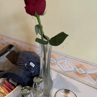 Deep red rose on every table adding specialness.