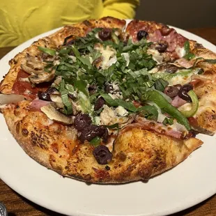 a pizza on a white plate