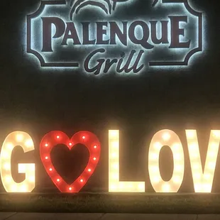 a neon sign with a heart