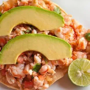 Tostada de Ceviche
 Shrimp Ceviche, marinated in lime juice w/tomato, onion, and cilantro served on a corn tostada &amp; an avocado layer on top