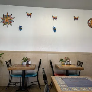 a dining area with tables and chairs