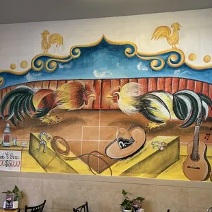 a mural of roosters and guitars