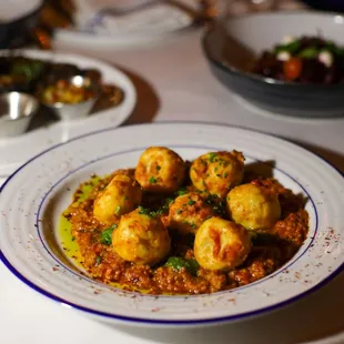 LAMB CROQUETTES 

Braised lamb shanks in Malbec, provoleta cheese, yogurt mint sauce