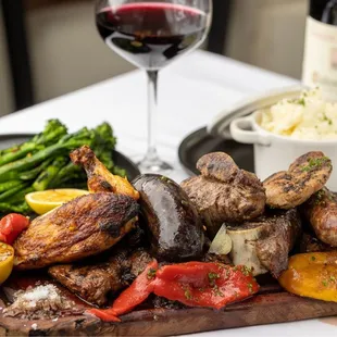 a platter of meat and vegetables