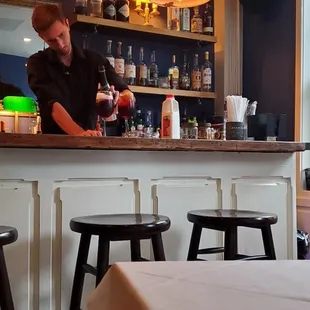 a bartender preparing a drink
