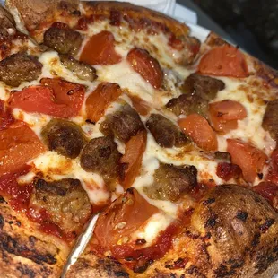 Kids pizza with tomatoes and sausage