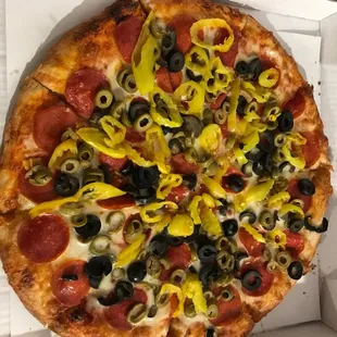 Pepperoni, black olives, green olives and mild peppers.  Yum!