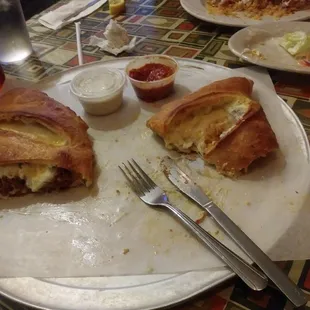 Partially eaten meatball calzone