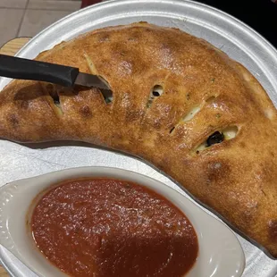 Greek Calzone Large. Very rich in a good way amazing marinara