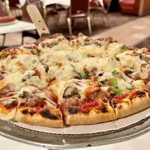 a pizza on a serving tray