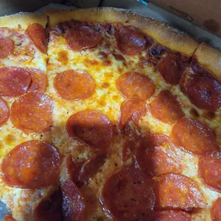 a pepperoni pizza in a box