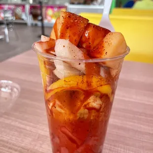 a cold drink with fruit in it