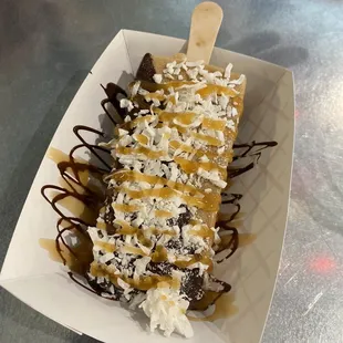 a banana split in a paper container