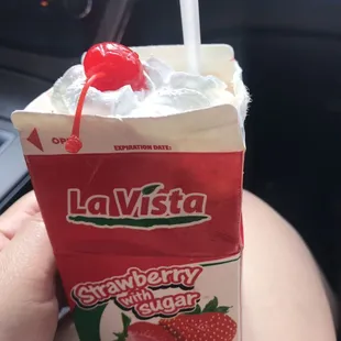 Fresas con crema. Frozen strawberries and they just added lechera and whipped cream on top.