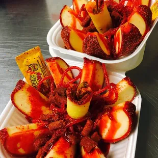 Crazy apple- covered in tamarind and chile powder opened and prepared with chamoy and tamarind candies!