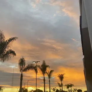 a sunset over a parking lot