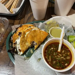 Quesabirrias w/ consommé and tomatillo, churros with chocolate sauce, mango pineapple agua fresca, and horchata agua fresca