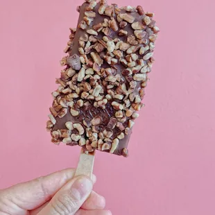 Cookies &amp; Cream Paleta &quot;Eskimo Style&quot; covered in pecans.